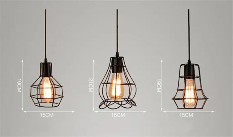 Three black iron art pendant lights with retro iron art wire cages and exposed filament bulbs for industrial style decor