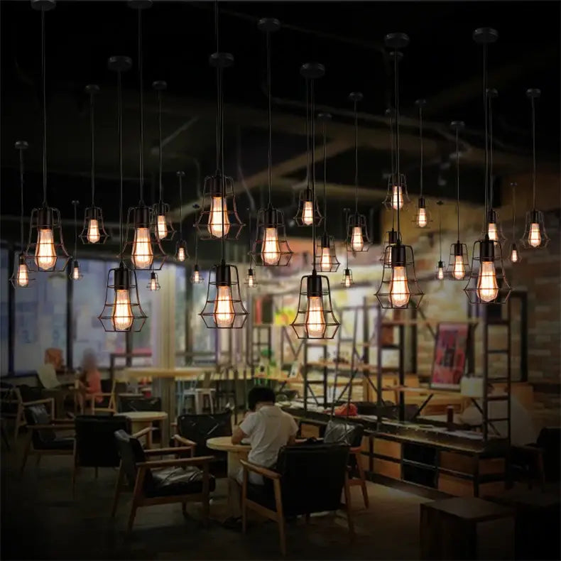 Decorbites retro iron art pendant light featuring black metal industrial-style iron art with glowing filament bulbs
