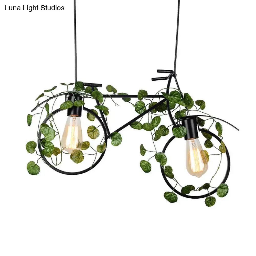 Black metal bicycle restaurant ceiling light with two exposed bulbs and green plant decor for retro ambiance
