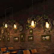 DecorBites™ retro metal bicycle restaurant ceiling light with black wrought iron frames, exposed bulbs, and plant decor
