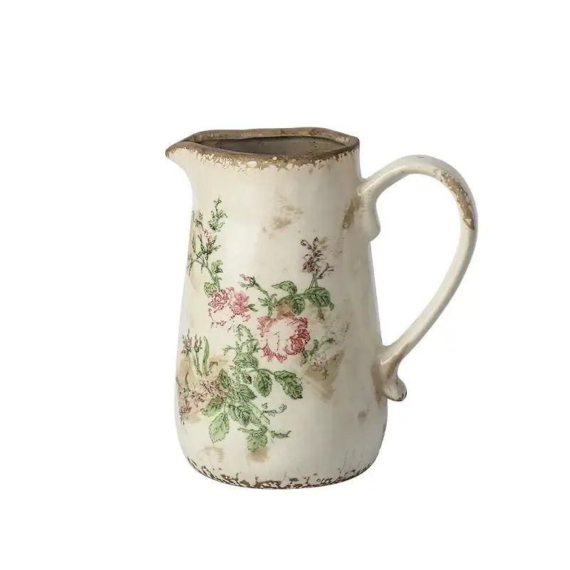 Antique-style white ceramic vase with pink floral decals and rustic finish in decorbites retro nordic ceramic style