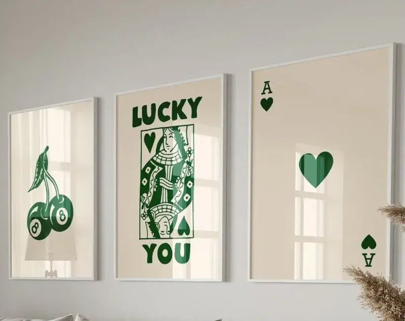 Set of three DecorBites™ retro queen of hearts canvas posters set with green playing card and lucky charm designs on cream background