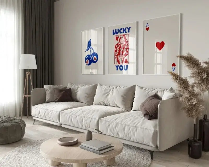 Beige upholstered sectional sofa with dark brown accent pillows next to decorbites™ retro queen of hearts canvas wall art set