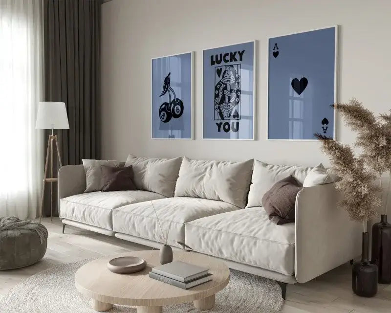 Beige upholstered sectional sofa with soft modern design and dark brown pillows complementing hearts canvas wall art set