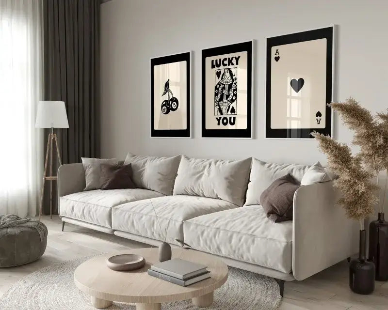 Beige upholstered sectional sofa with soft modern design and dark brown throw pillows next to decorbites retro queen of hearts canvas wall art set