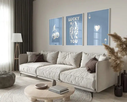 Beige upholstered sectional sofa with dark brown accent pillows next to decorbites™ retro queen of hearts wall art set