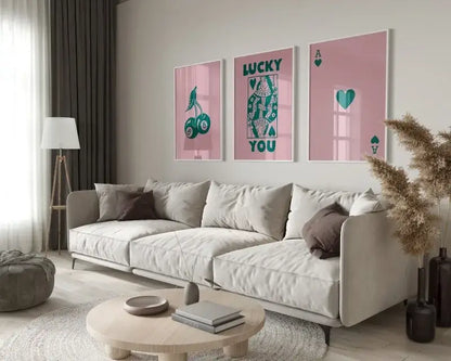Beige upholstered sectional sofa with dark brown throw pillows next to decorbites™ retro queen of hearts wall art set