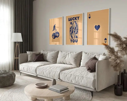 Beige sectional sofa with dark brown throw pillows shown alongside the decorbites retro queen of hearts hearts canvas wall art set