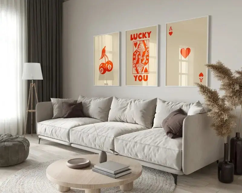 Beige sofa with gray and brown throw pillows below decorbites™ retro queen of hearts hearts canvas wall art set