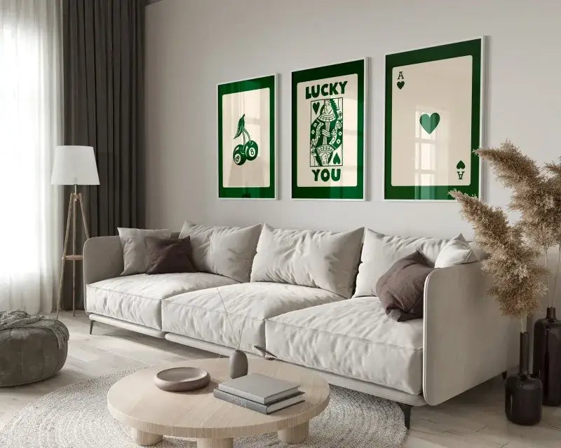 DecorBites™ retro queen of hearts wall art set features three framed green and cream hearts canvas artworks above sofa