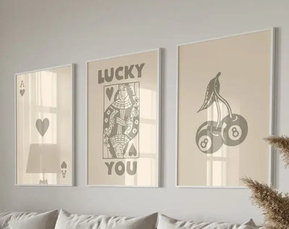 Three framed wall art set featuring retro queen of hearts canvas with minimalist gray illustrations on beige backgrounds