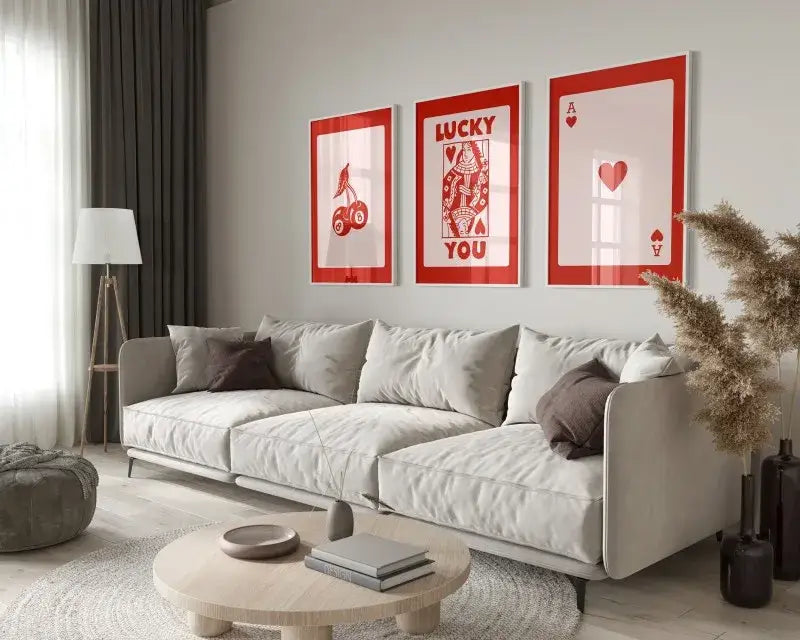 Three framed red and white hearts canvas wall art set from decorbites™ displayed above a light gray sofa