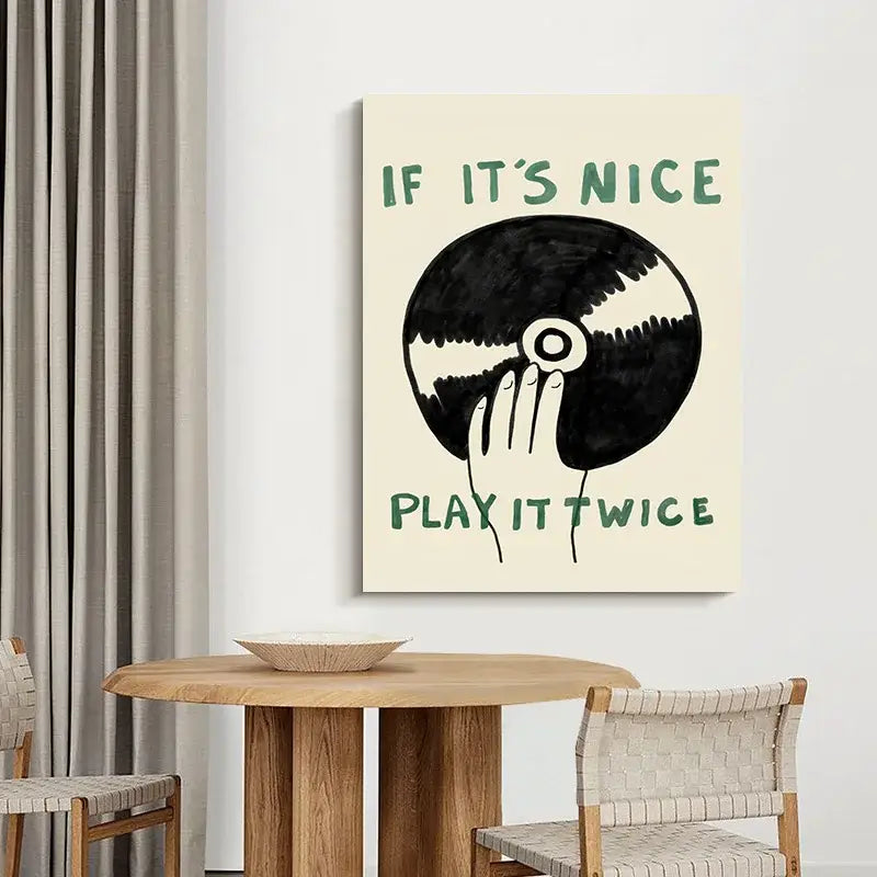 Cream-colored canvas wall art by DecorBites featuring a black and white hand holding vinyl record with green text for modern music play