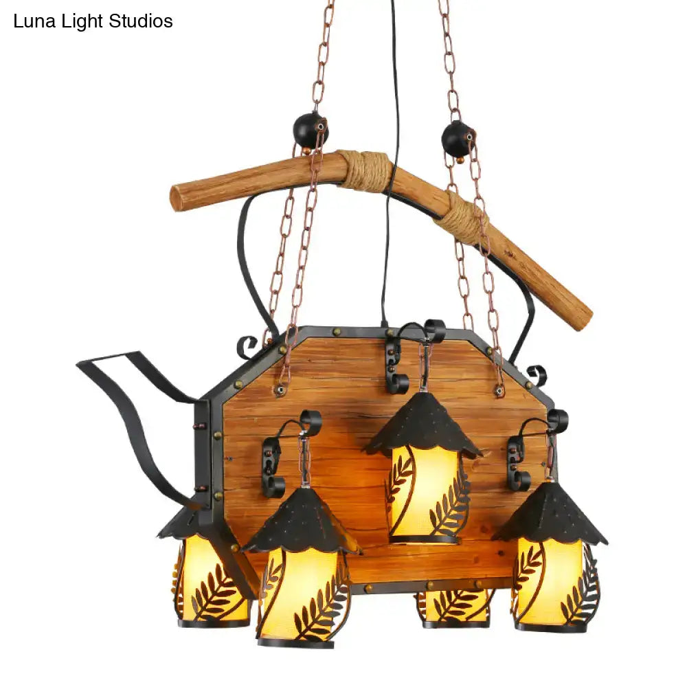Rustic wooden teapot-shaped chandelier with black metal accents and white fabric clear glass shade for restaurants