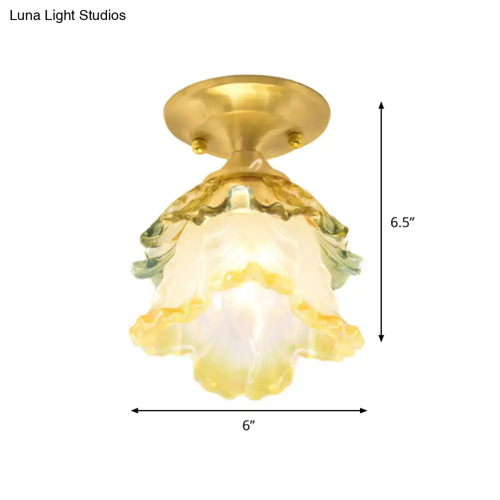 A decorbites™ retro style gold ruffle glass ceiling lamp with hand-blown yellow and green shade and brass base