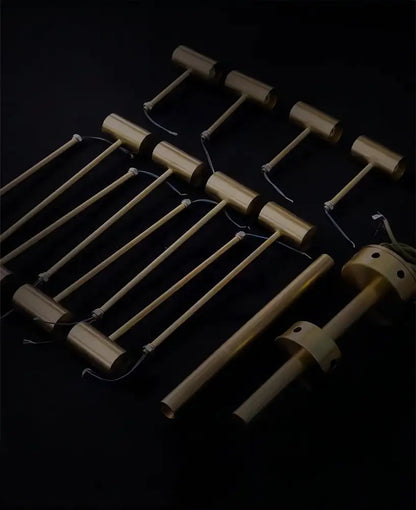 Set of brass-colored cylindrical mallets with wooden handles for decorbites™ retro-style walnut acrylic ceiling light in living room