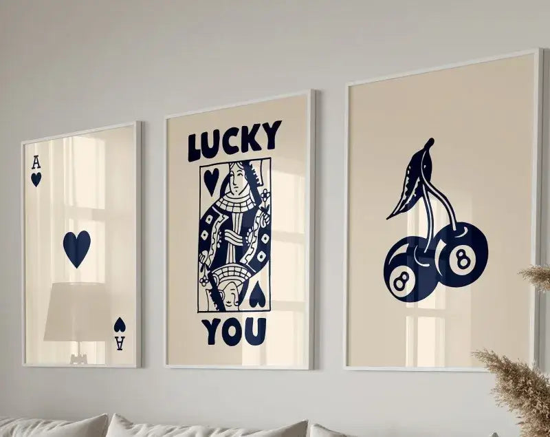 Three framed DecorBites™ retro wall art posters featuring navy blue playing card designs on cream canvas background