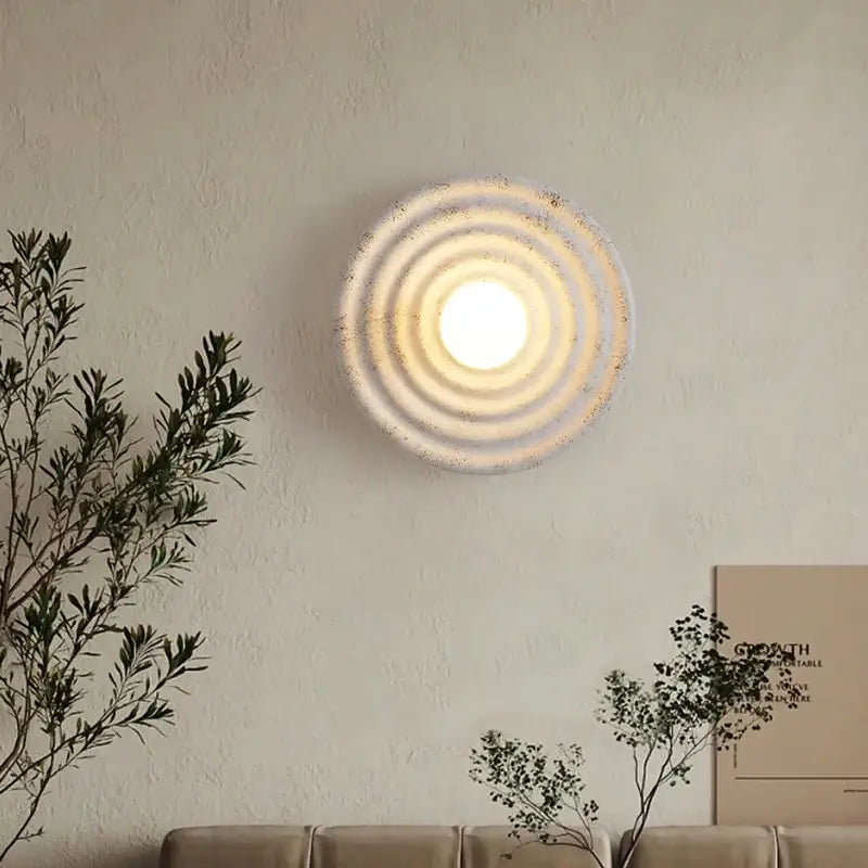 Decorbites round circle wall lamp with circular wall-mounted light fixture featuring concentric rings and warm glowing center