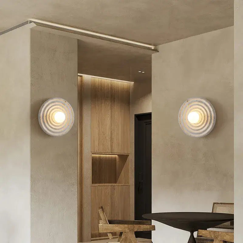 Decorbites round circle wall lamp featuring circular wall sconces with concentric rings and warm glowing light