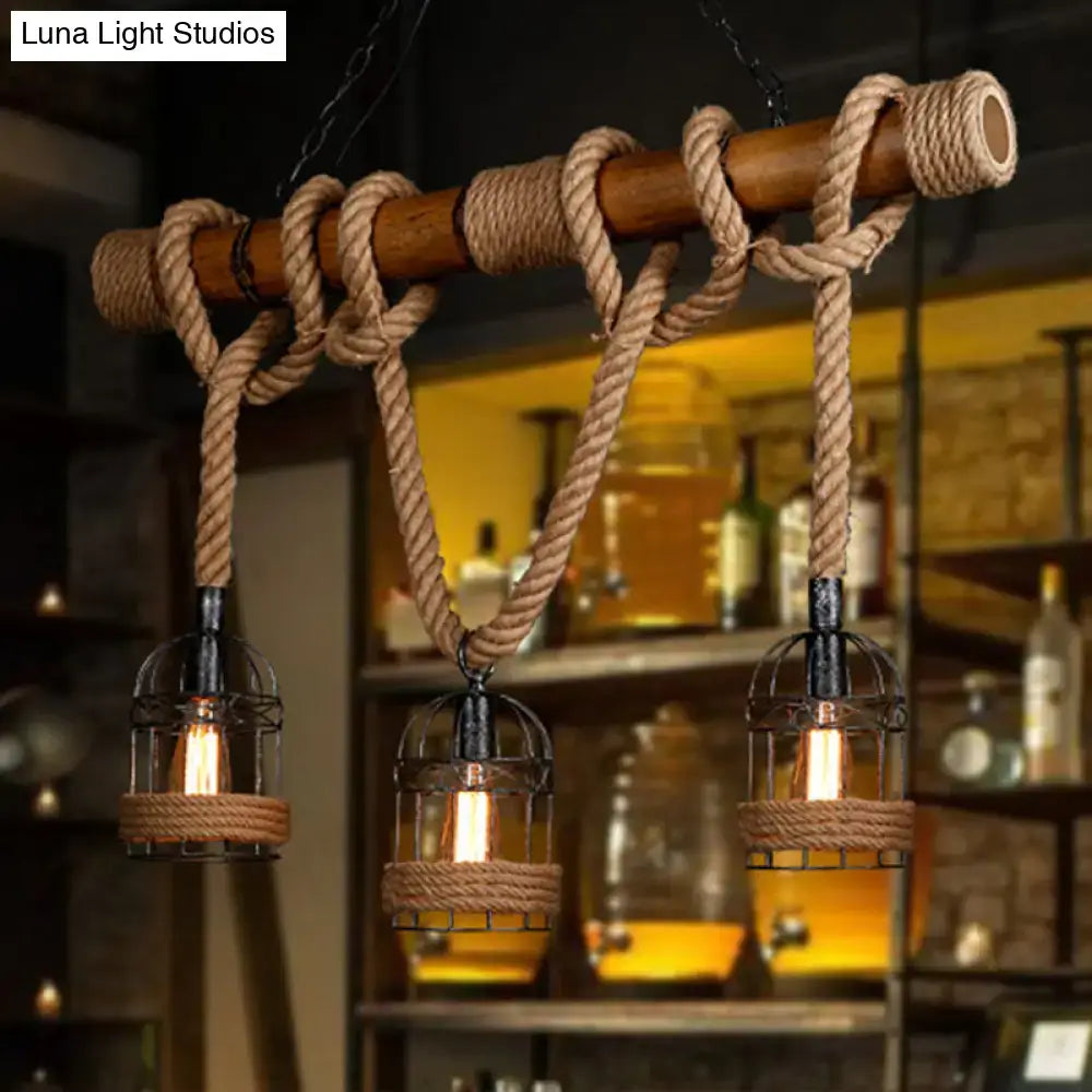 DecorBites rustic bamboo island lighting chandelier with wooden beam, thick beige rope ties, and three wire cage lanterns