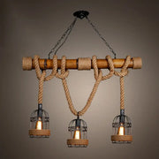 Decorbites™ rustic bamboo island lighting chandelier in beige with natural bamboo beam and thick rope suspending wire cage lanterns