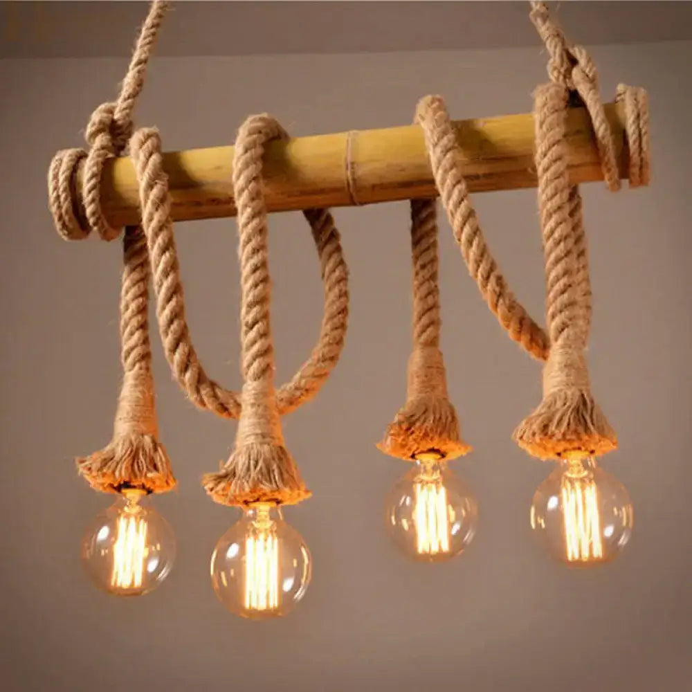 Rustic bare bulb pendant light with bamboo pole, thick beige rope, and four glowing filament bulbs by decorbites