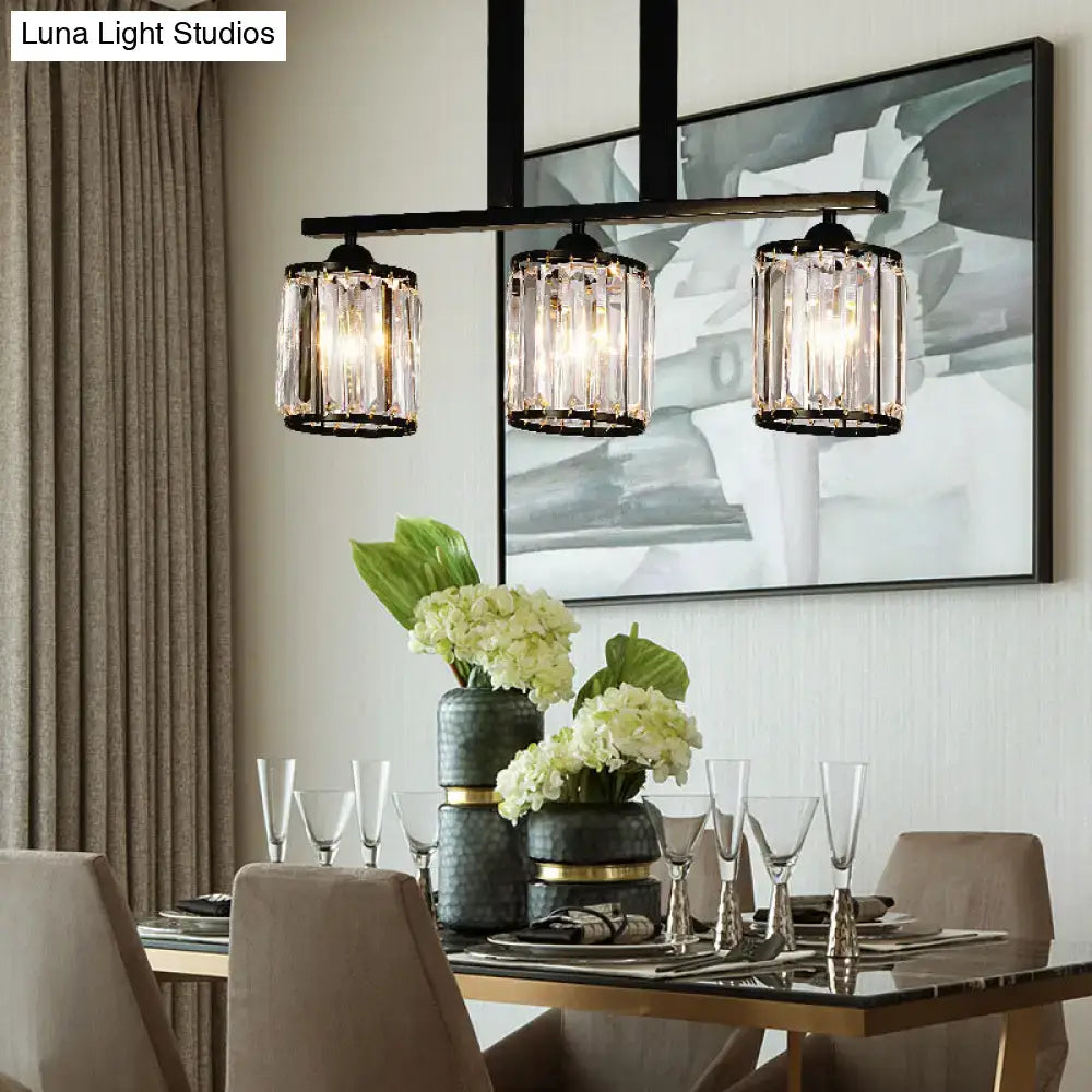 Black metal cylindrical island pendant with three prismatic crystal cylinder shades ideal for tables by DecorBites