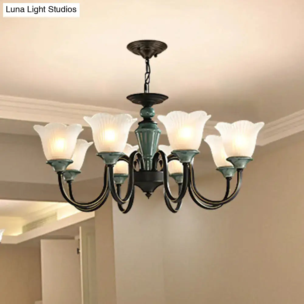 Antique bronze and blackish green floral chandelier with six frosted glass flower-shaped shades for living room