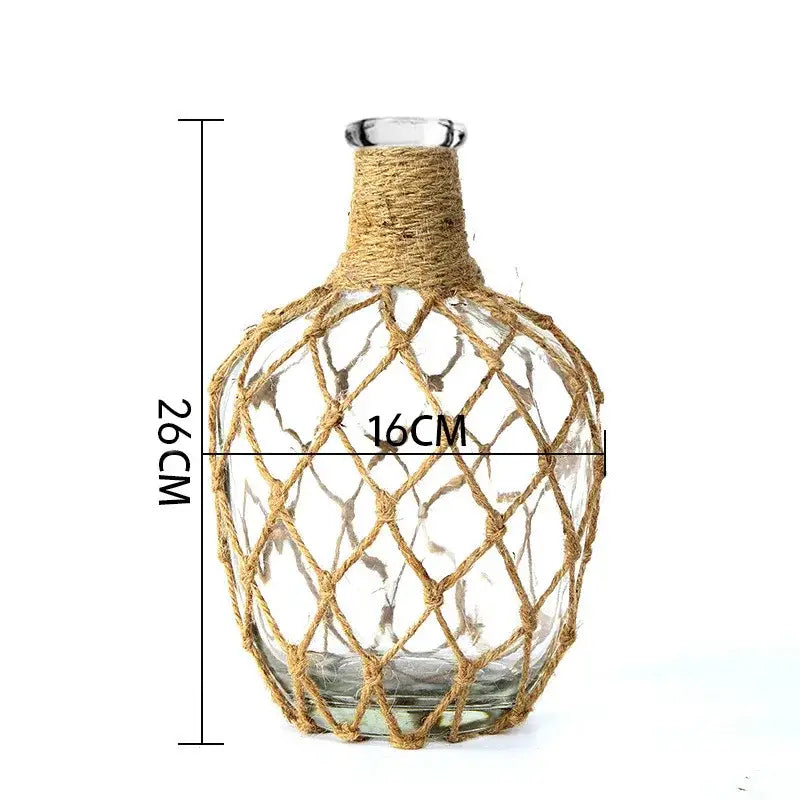 Clear glass vase wrapped in natural jute rope with diamond-pattern weave for rustic hanging glass vase decorbites hanging glass vase