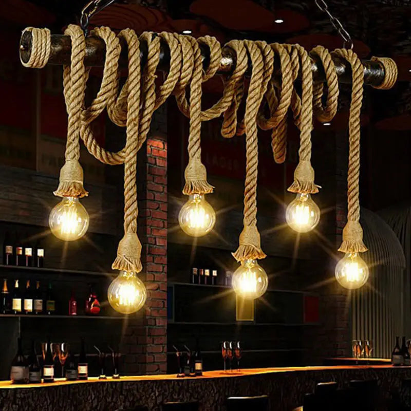 Industrial-style jute rope island pendant light with beige jute rope and five glowing edison bulbs for wine bar decor