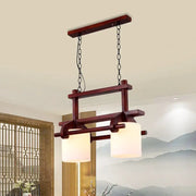 DecorBites™ rustic wooden island light with two white glass shades hanging by black chains for dining room use