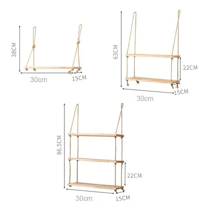 Light-colored rustic wood floating wall shelves by decorbites with natural rope suspension and small caster wheels set of 3