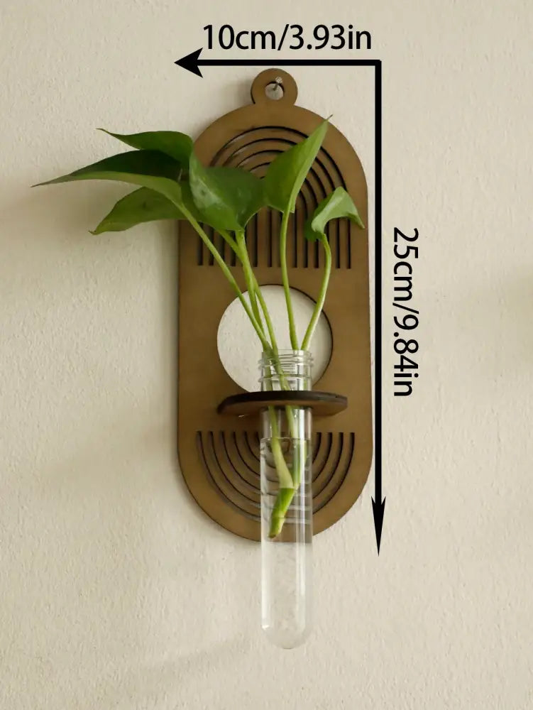 Bronze-colored rustic wood wall vase by decorbites with clear glass test tube holding green leaves for wall greenery