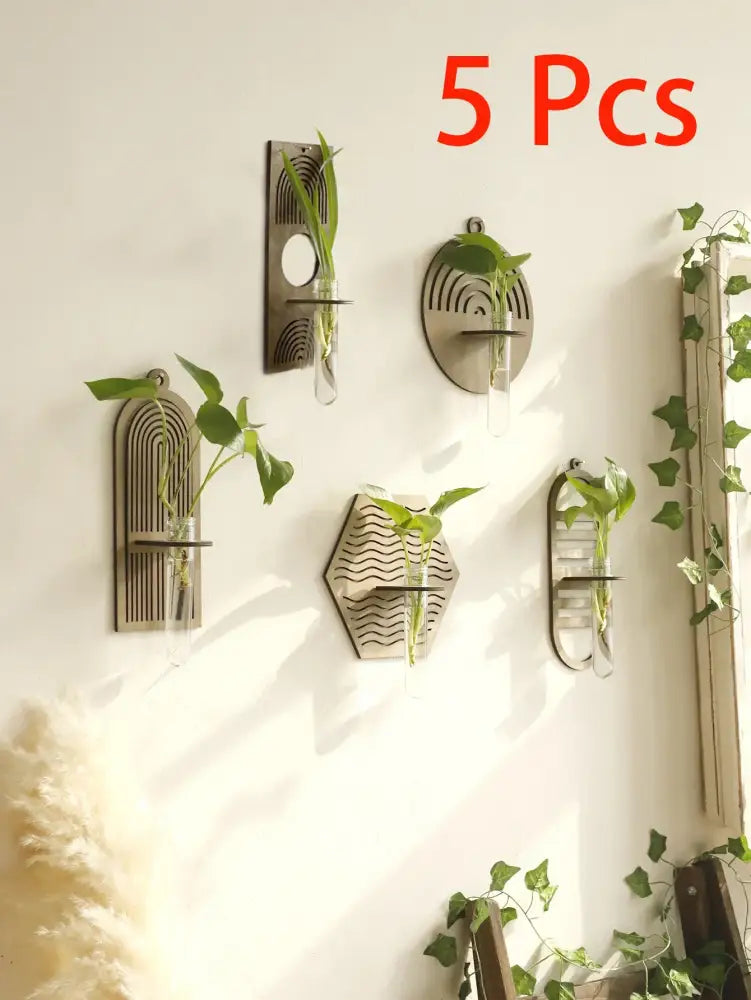 Set of five modern geometric wall vases with matte bronze metal frames and clear glass tubes for wood wall decor