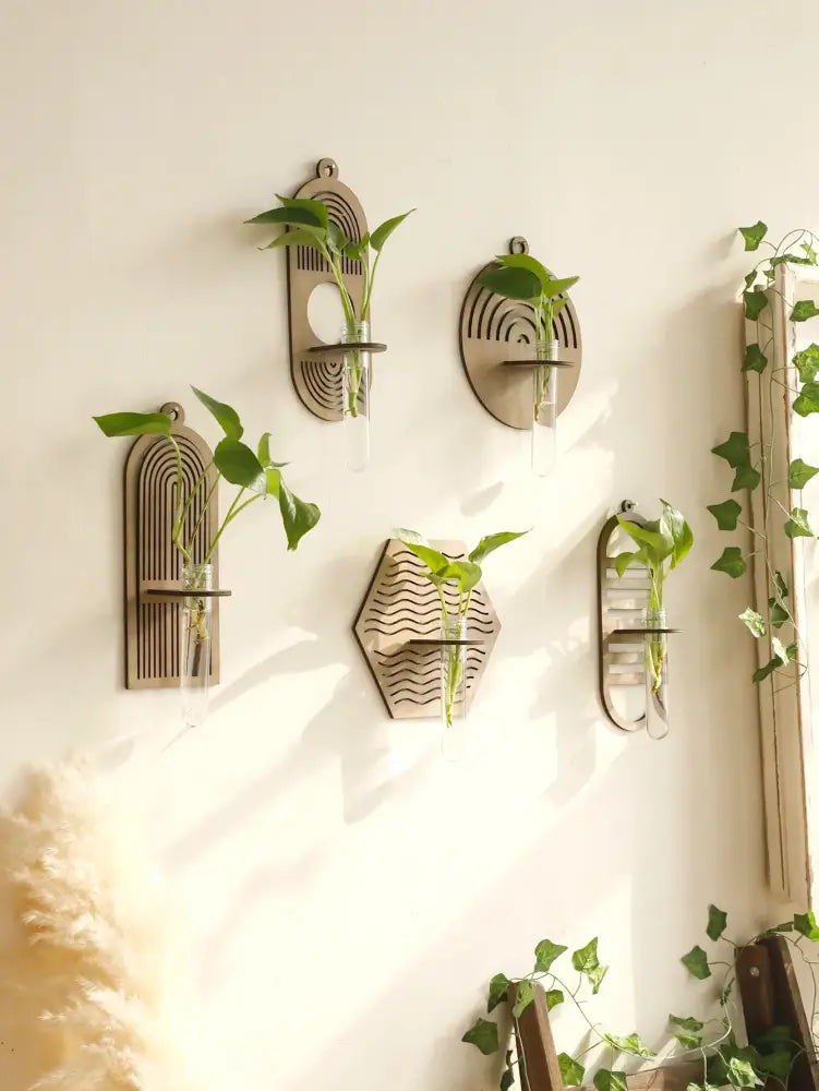 DecorBites™ rustic wood wall vase with geometric design and clear glass tubes holding green vines for wall decor