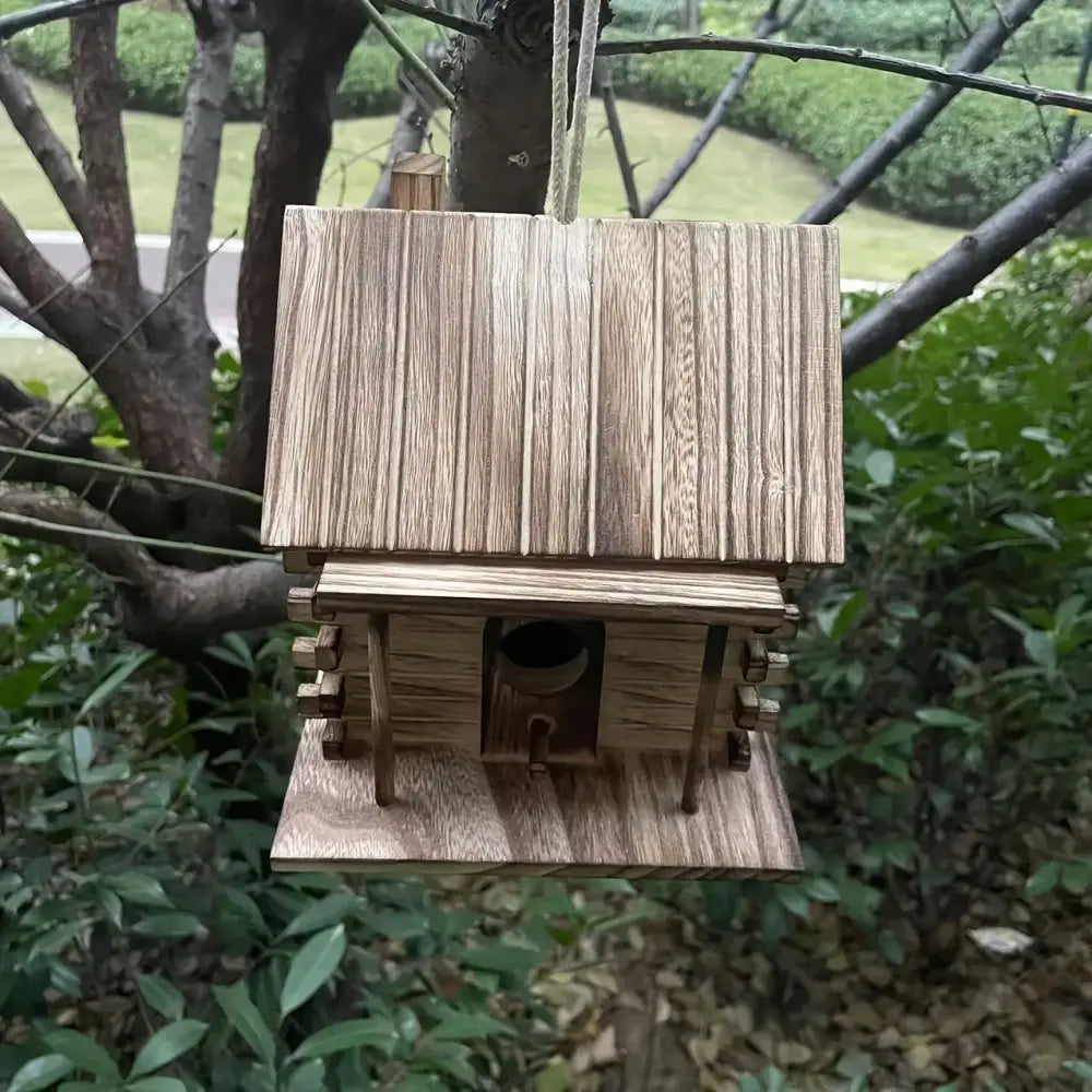Decorbites™ rustic wooden birdhouse for small birds with slanted roof made of light brown wood planks