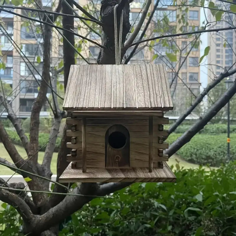DecorBites™ rustic wooden birdhouse made of light brown wood with slanted roof and arched entrance for small birds