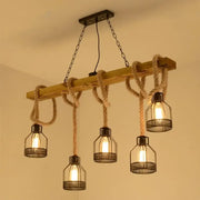Industrial-style DecorBites™ rustic wooden linear island lamp with beige rope suspension and black mesh cage pendant lights