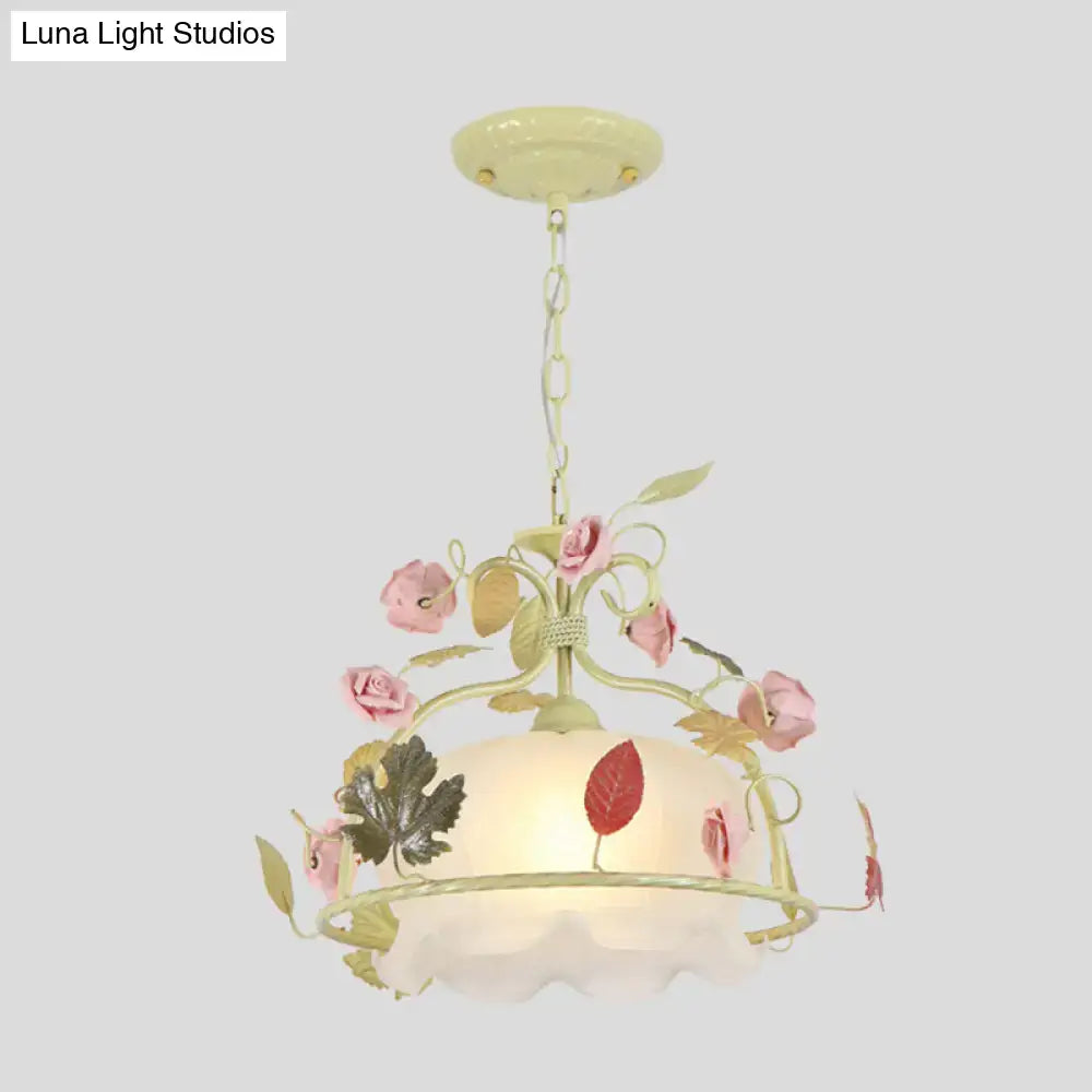Pastel yellow scallop chandelier light fixture with pink roses green leaves and frosted opal glass shade for living room