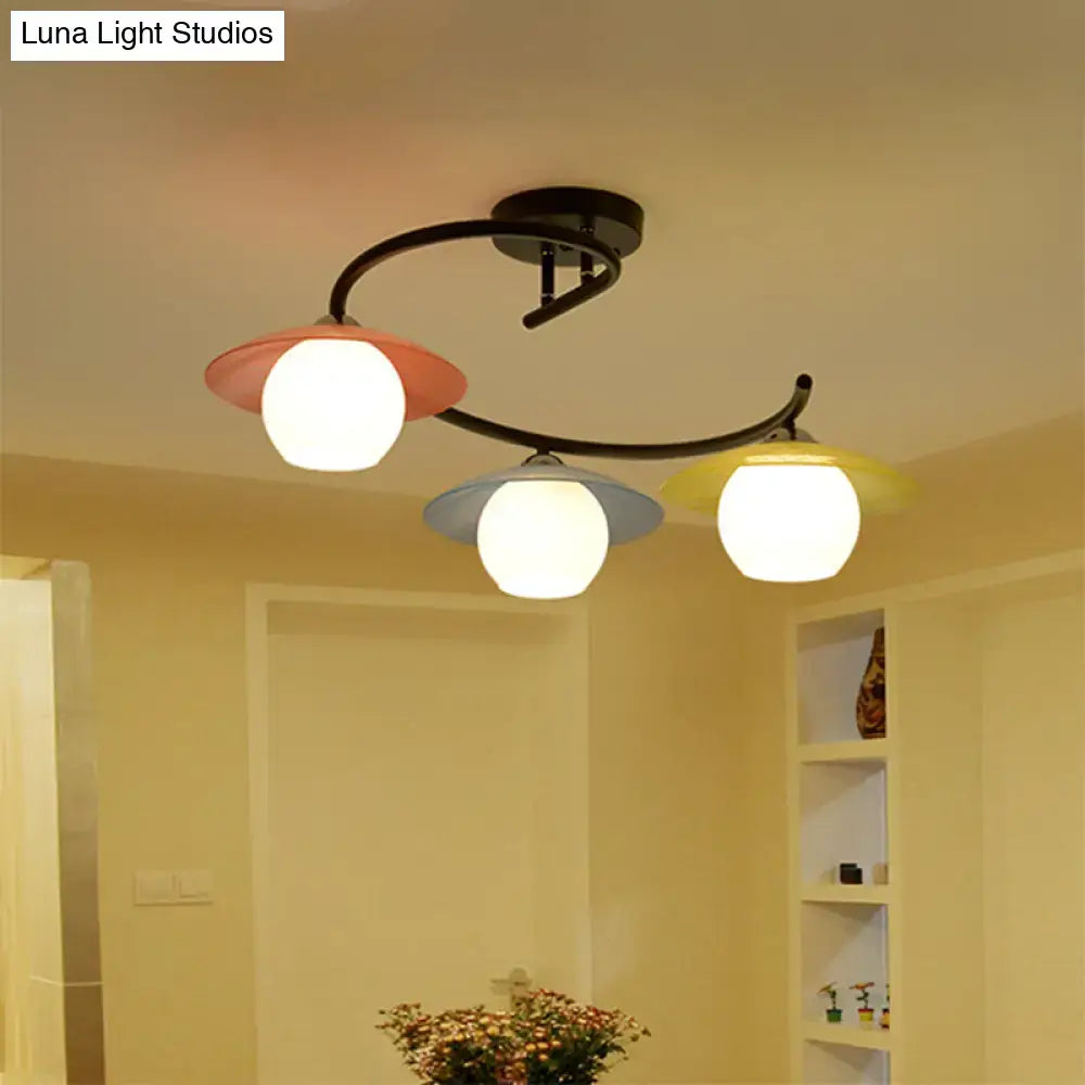 Decorbites semi flush light with black curved metal arms and coral gray yellow frosted glass shades in modernist design