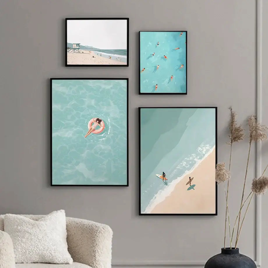 Set of four framed DecorBites™ serene beach watercolor illustration prints with minimalist black frames in soft teal pink and beige colors