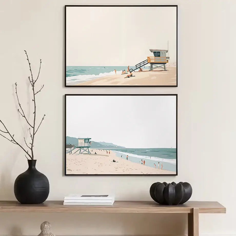 Two framed decorbites serene beach watercolor illustration prints featuring minimalist lifeguard towers and pastel shores