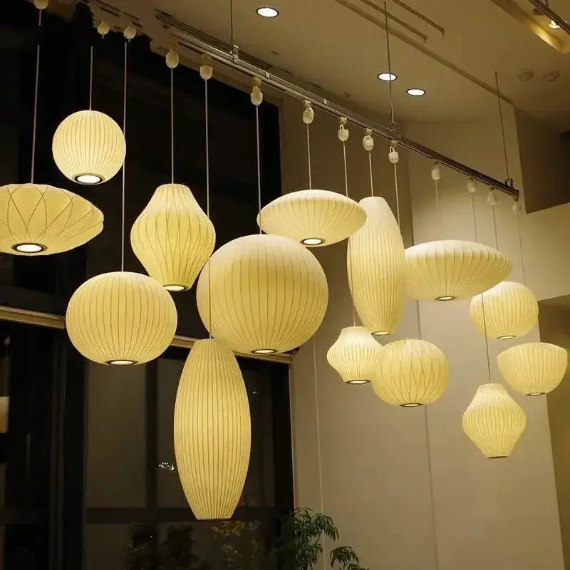 Cream-colored ribbed silk led pendant lamp collection by decorbites in organic shapes for modern designer lighting