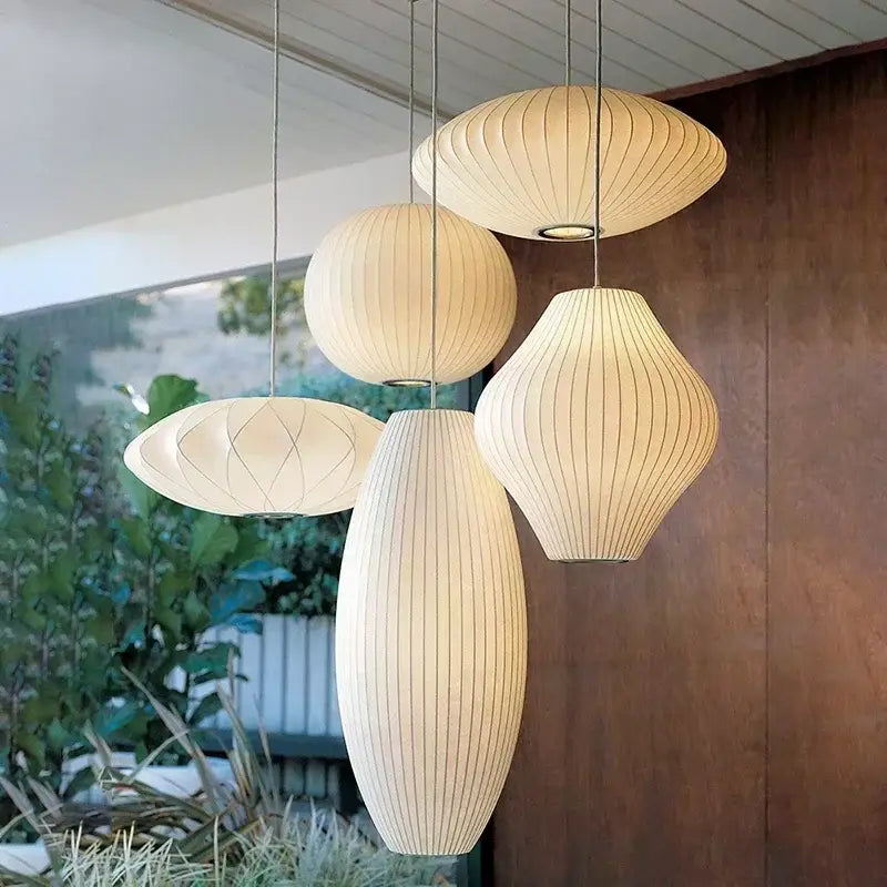 Cream-colored ribbed paper silk led pendant lamp with modern sculptural design by DecorBites for stylish lighting