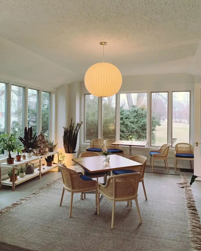 A warm spherical led pendant lamp with a ribbed paper shade from decorbites modern designer lighting