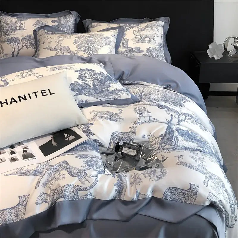 Blue and white toile eucalyptus fiber duvet cover with elegant leopard illustrations on satin-like fabric by decorbites