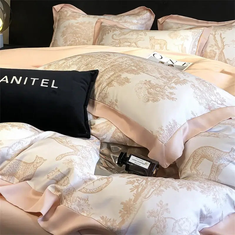 Elegant blush pink satin duvet cover and bed sheet with beige leopard and botanical print in eucalyptus fiber by DecorBites