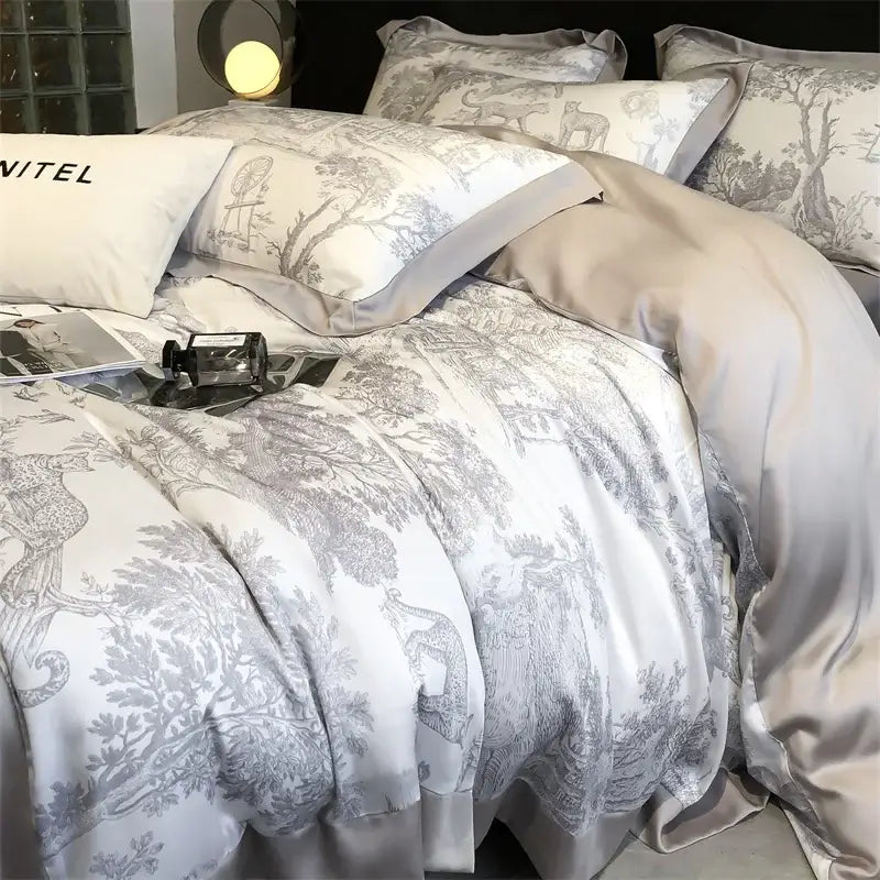 Elegant white satin duvet cover set with gray toile forest motifs and matching pillowcases made of eucalyptus fiber