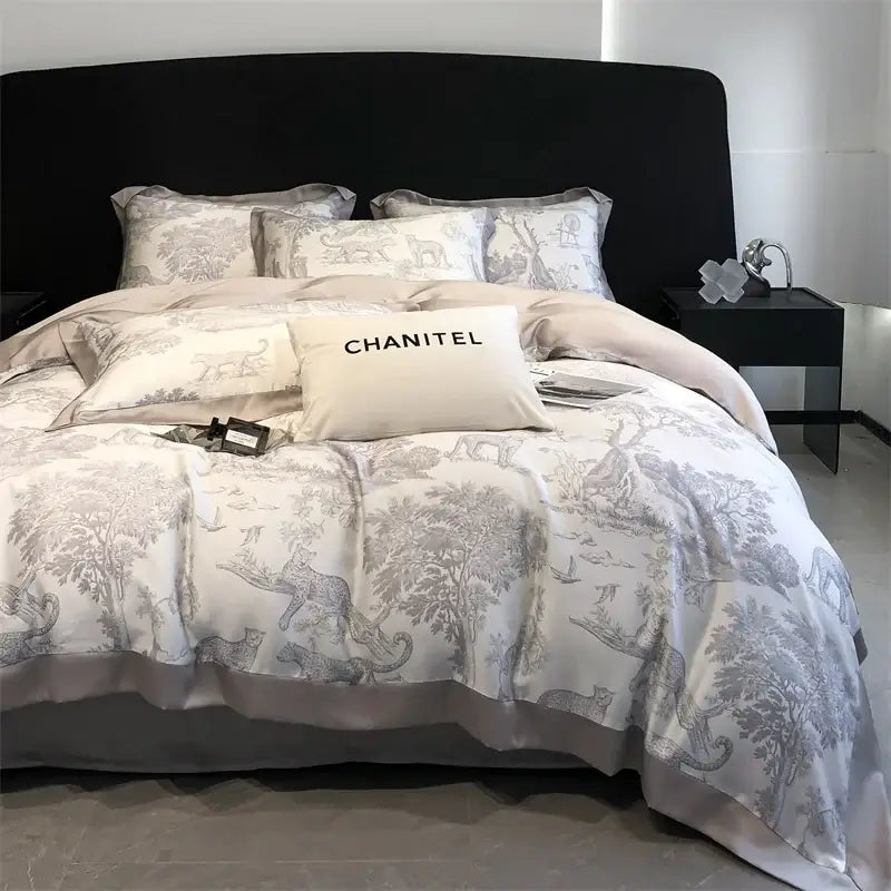 Gray and white toile-patterned satin duvet cover and bed sheet set with eucalyptus fiber featuring a cream chanitel pillow