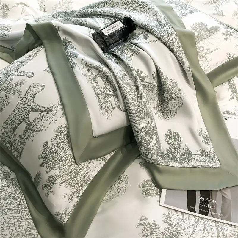 A soft sage green silk scarf with black and white forest leopard toile pattern complements eucalyptus fiber bedding set